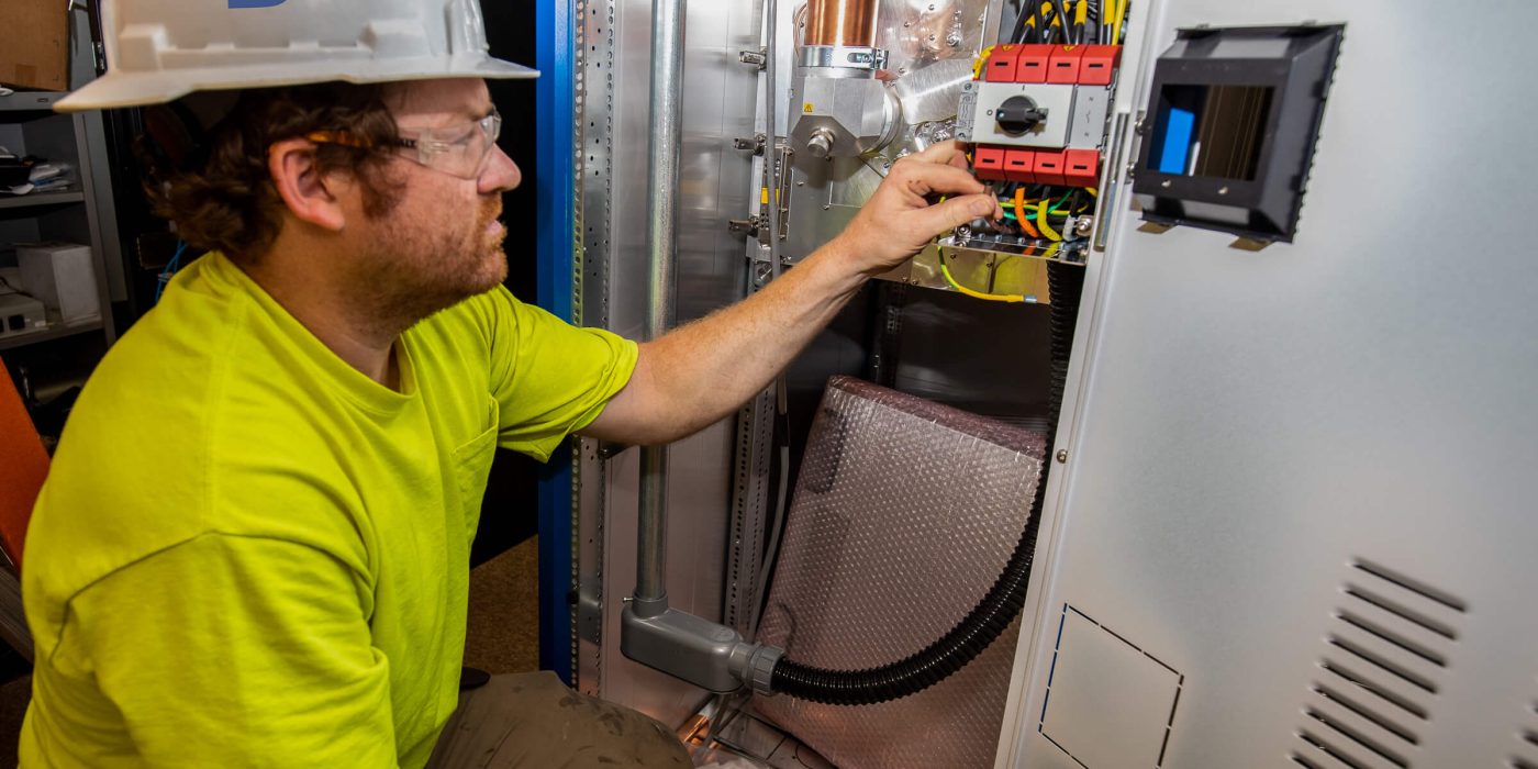 Electrician inspecting wiring